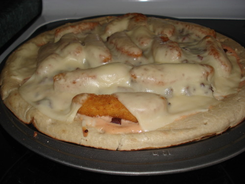 Chicken Finger Bacon Pizza A pizza consisting of Thousand Island dressing as the sauce, topped with a family size bag of chicken fingers, a container of bacon bits all smothered in sliced mozzarella cheese. (submitted by Bill Pattison)